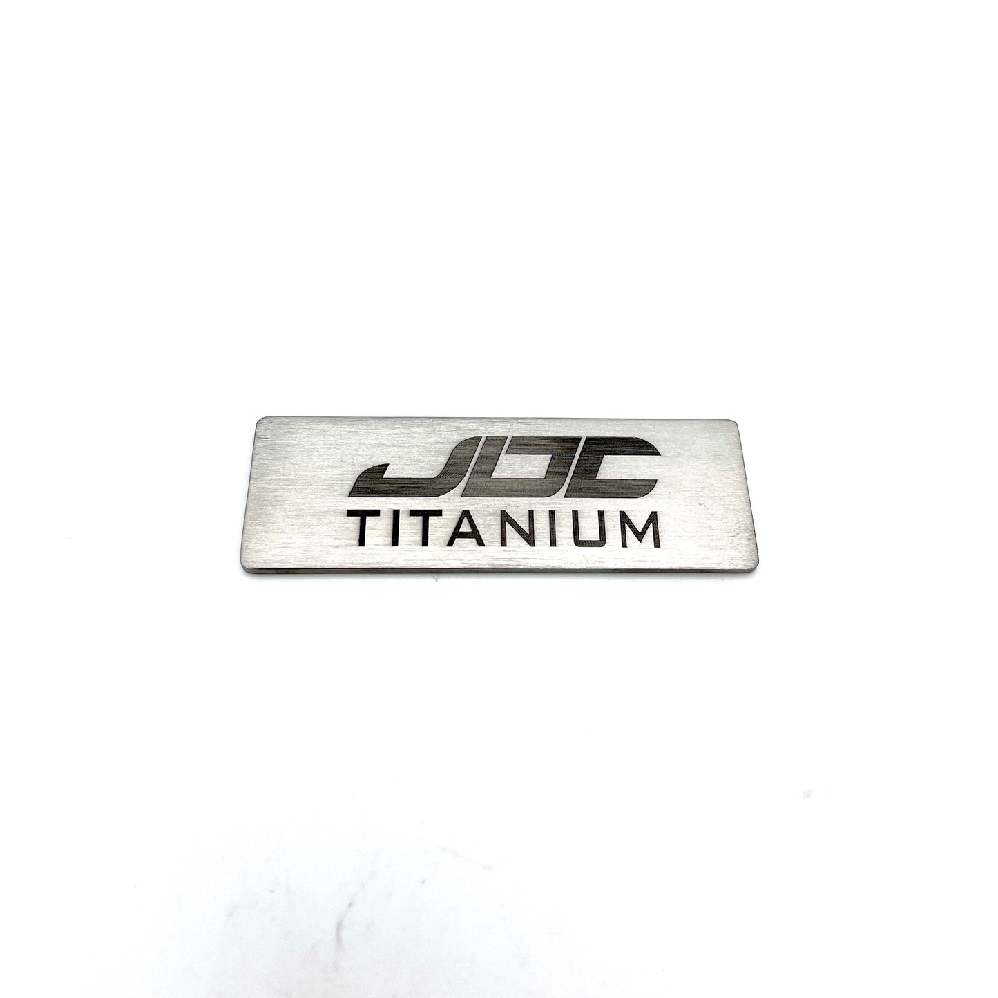 JDC Titanium Badge | 75mm x 25mm (Universal)